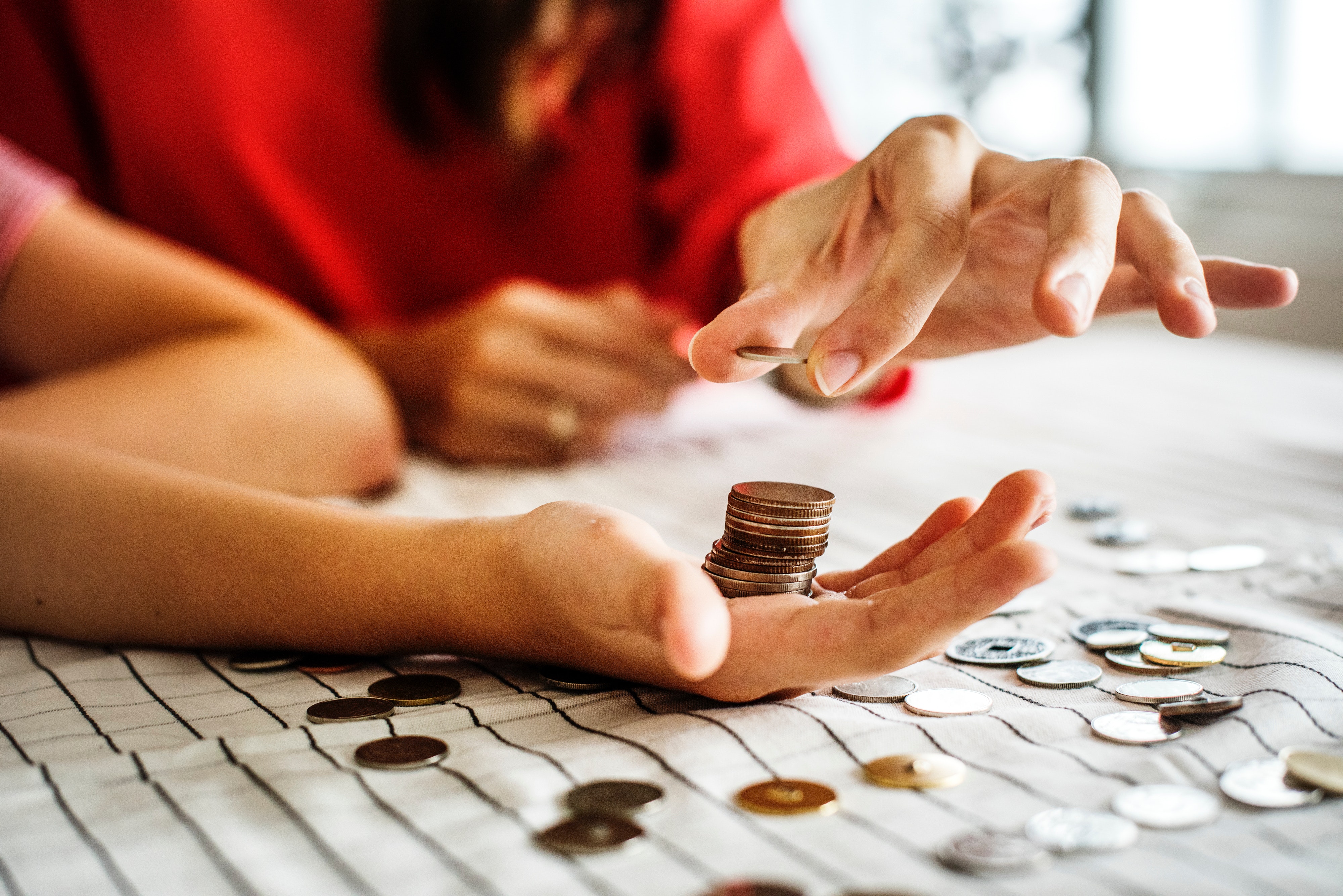 adults budgeting with coins