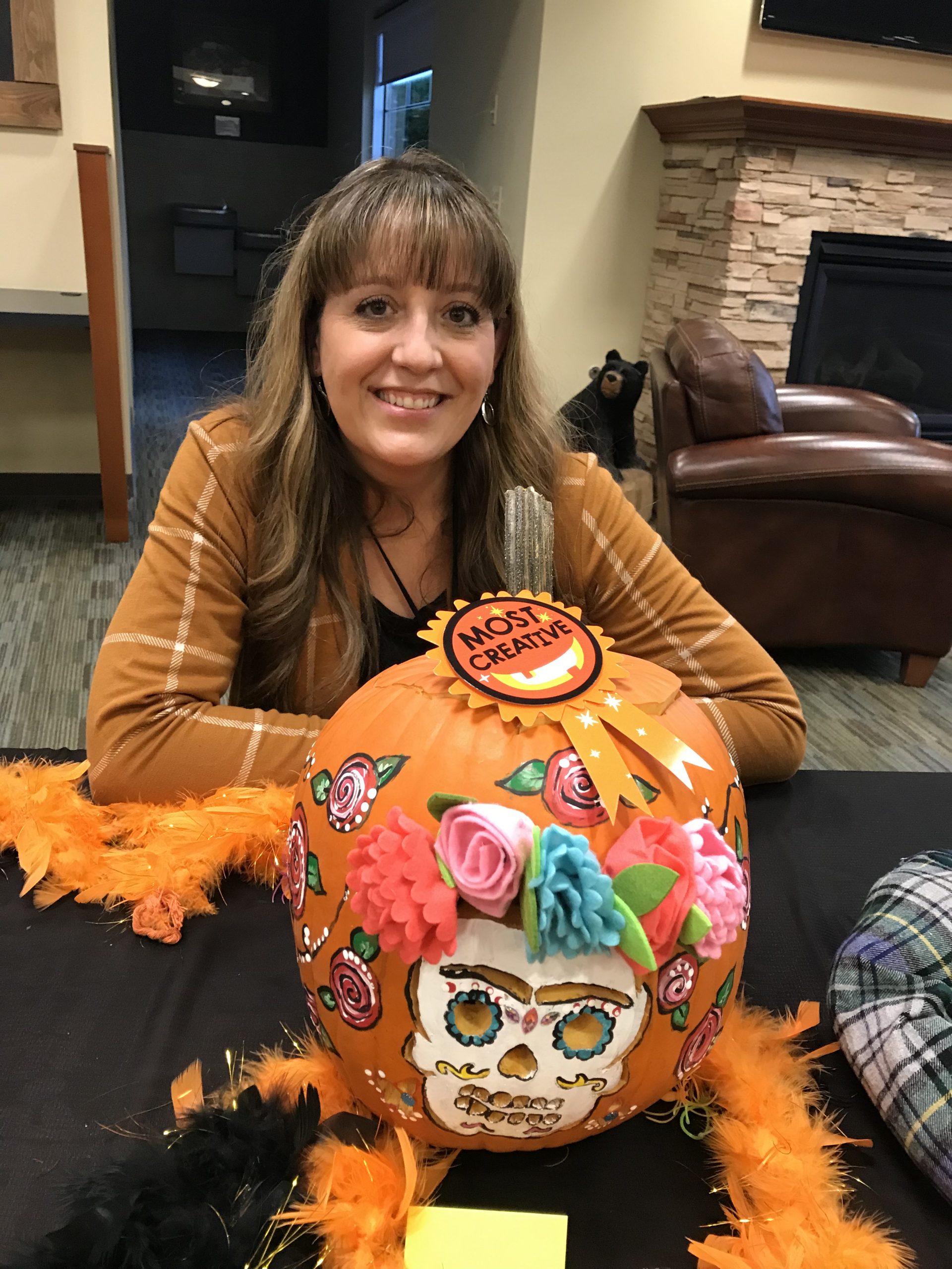 Women with painted pumpkin