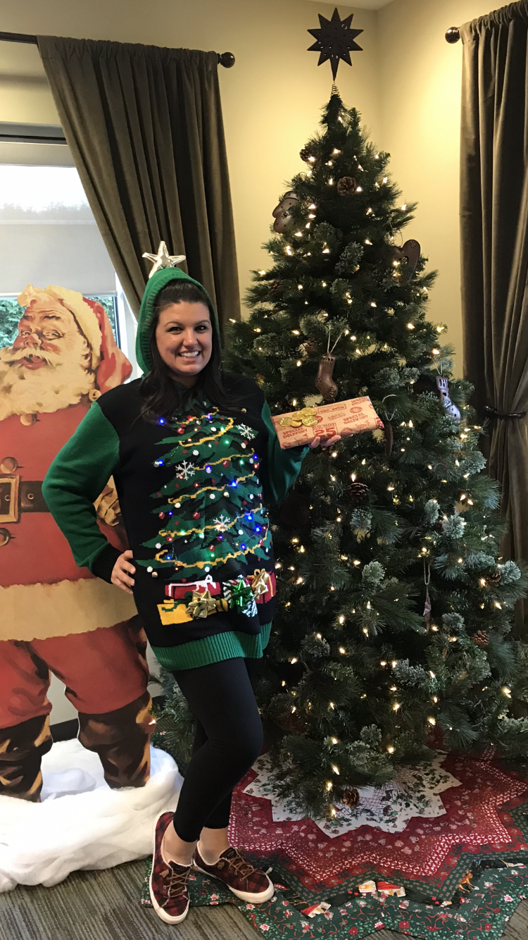 Woman in christmas tree sweater with christmas tree