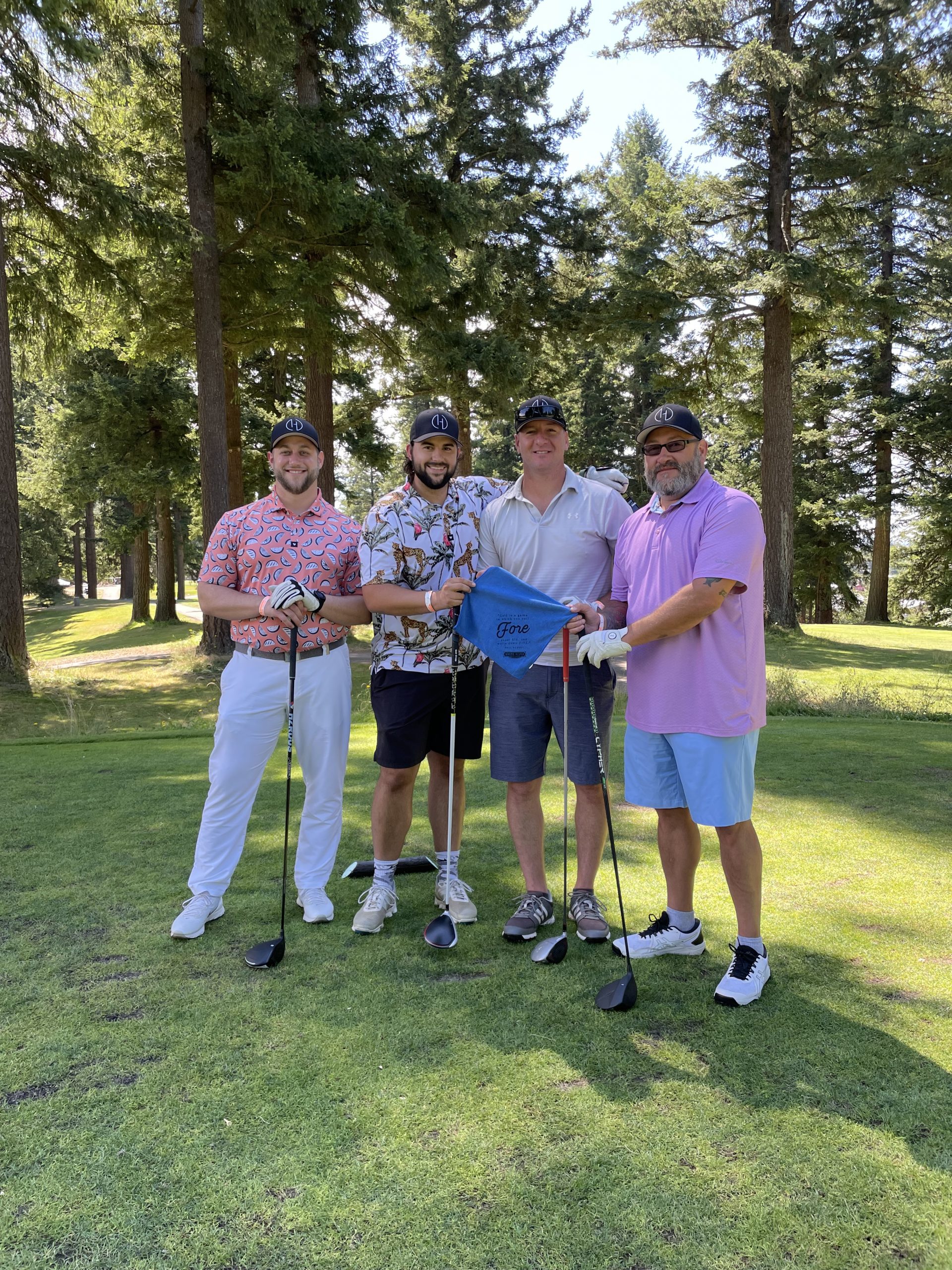 Golfers posing with WRCU swaf