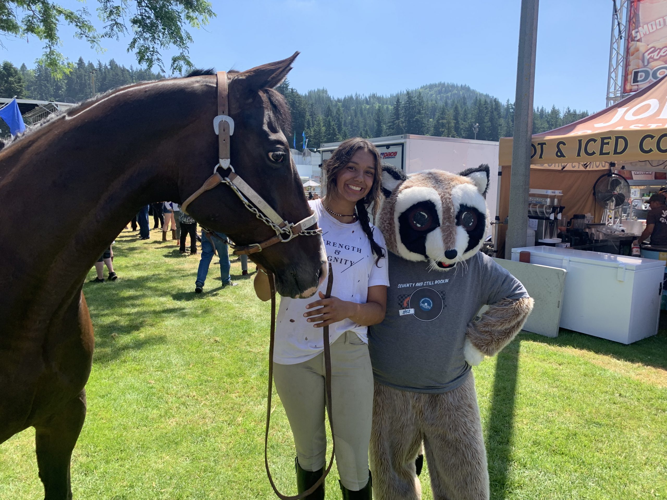 Rocky Raccoon next to a horse