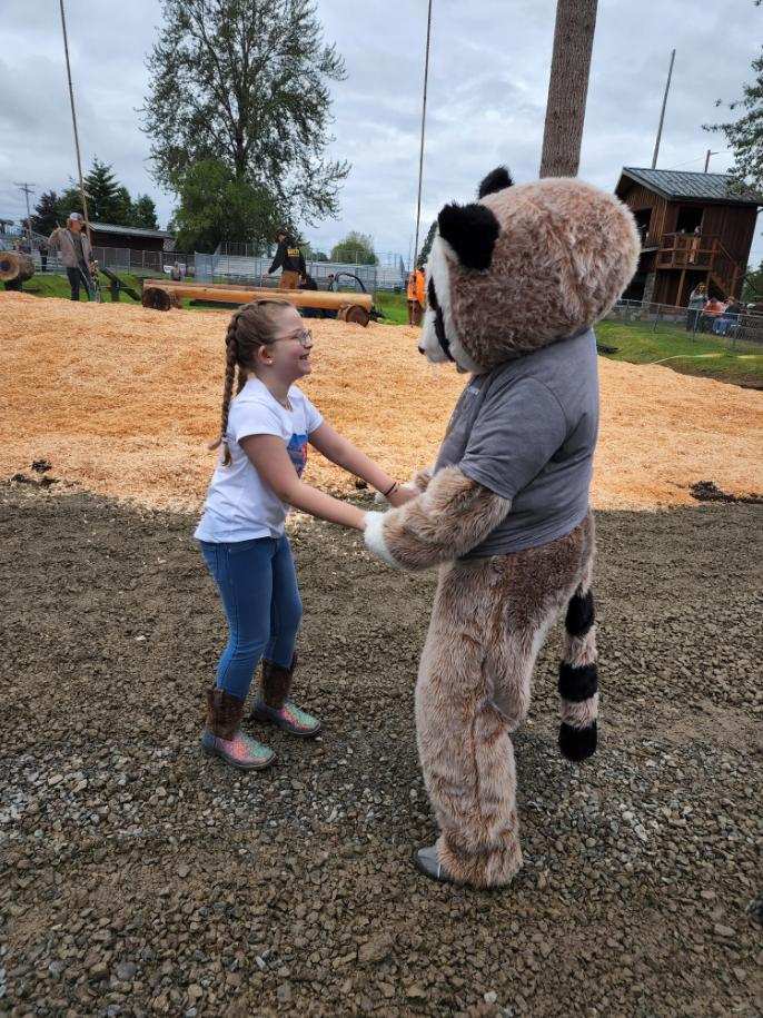 Rocky the Raccoon connecting with the community