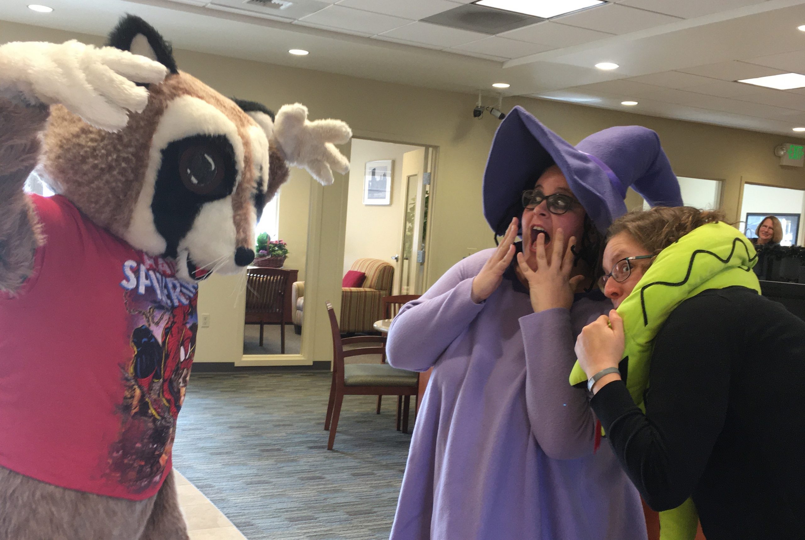 Financial education for kids blog. Rocky Raccoon is pretending to scare his friends at WRCU for a Halloween celebration.